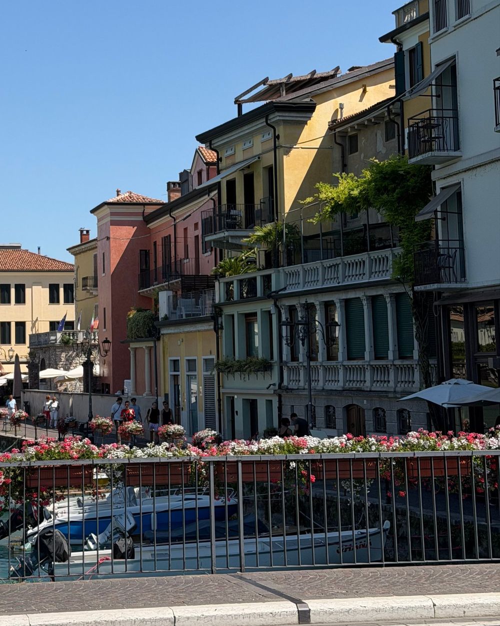 Pastel houses along a canal in Peschiera