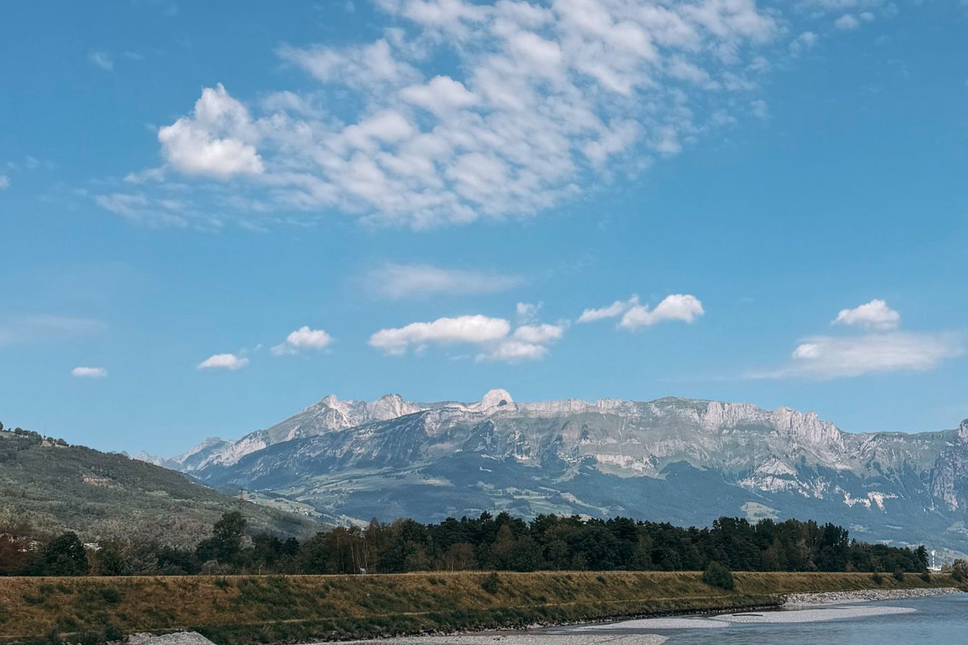 The Rhine and the Swiss mountains seen from the Liechtenstein cycle path