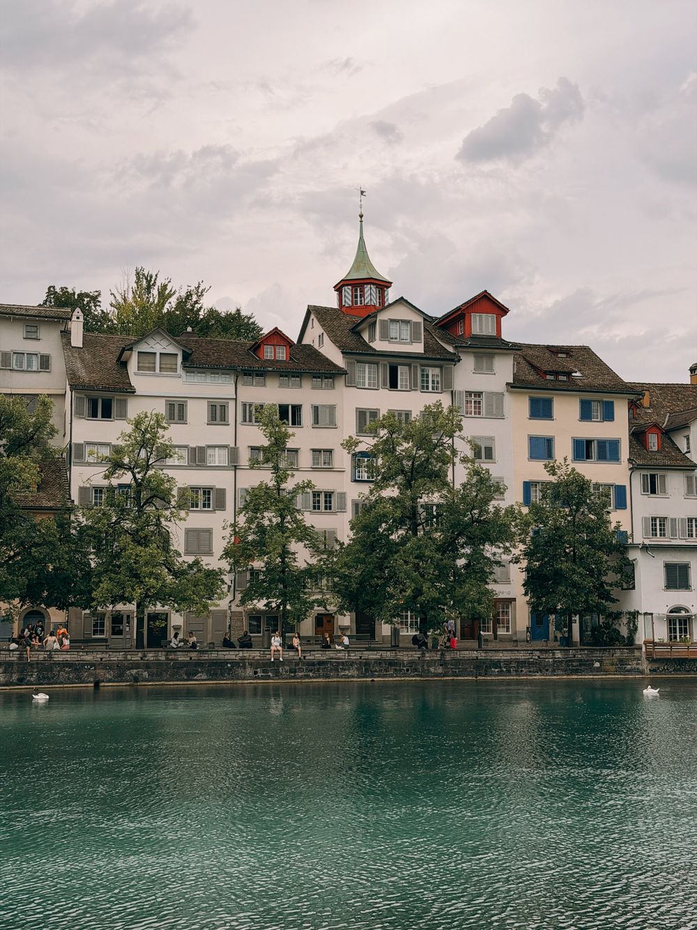 Old houses with shutters along the Limmat in Zurich