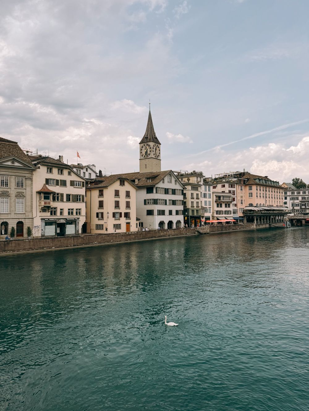 The Limmat river and St. Peter's church clock tower in Zurich